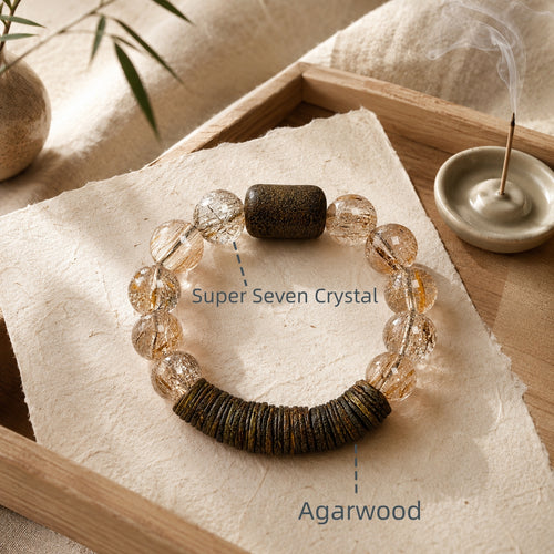 Exclusive Agarwood and Super Seven Crystal bracelet with warm wood texture and golden crystal inclusions