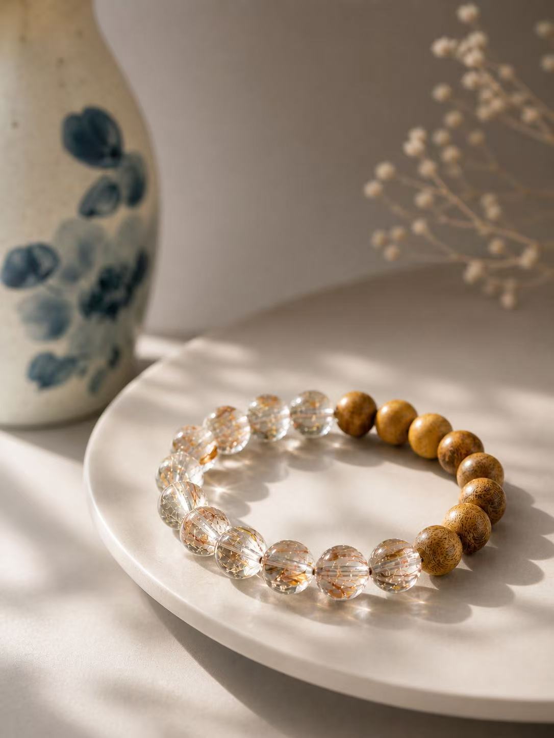Close-up of Agarwood beads and golden inclusions in Super Seven Quartz